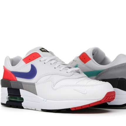 Nike Air Max 1 Evolution Of Icons CW6541-100, trois-quarts de la paire asymétrique