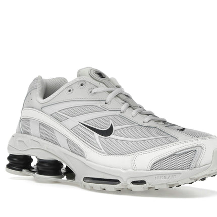 Nike Shox Ride 2 Light Bone Metallic Black II7635-002, trois-quarts avant extérieur