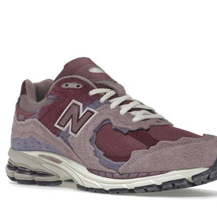 New Balance 2002R Protection Pack Pink M2002RDH, trois-quarts avant extérieur