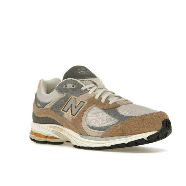 New Balance 2002R Mushroom Hazy Peach M2002REJ, trois-quarts avant extérieur