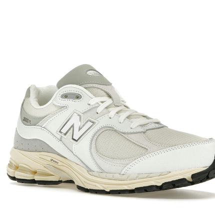 New Balance 2002R White Gold M2002RIA, trois-quarts avant extérieur